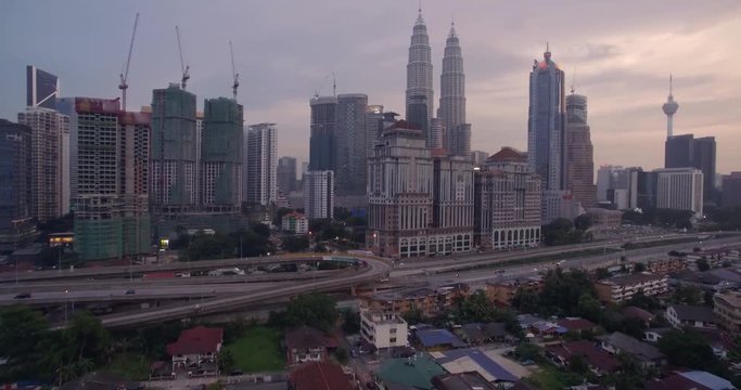 Sunset Over Kuala Lumpur City Skyline at Dusk, Malaysia, Aerial Drone Footage