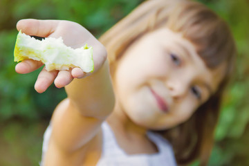 Child with an apple. Selective focus. 