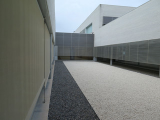 Enclosed courtyard with pebbled surface