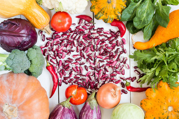 fresh vegetables on white painted wooden table. top view
