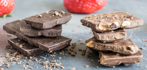 Dairy and bitter chocolate with strawberries and mint leaves