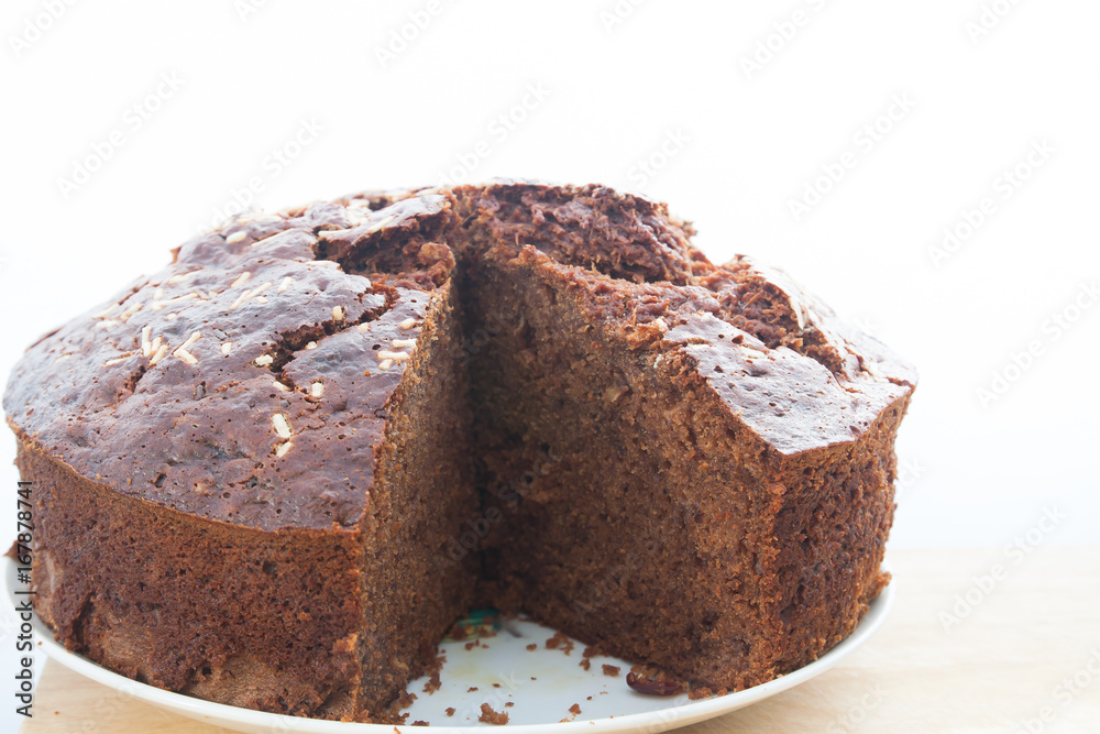 Wall mural Sliced tasty homemade banana chocolate cake on table