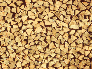 Woodpile with firewood texture background