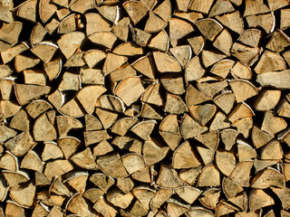 Woodpile with firewood texture background