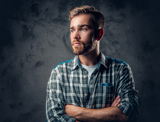 Bearded man over grey background.