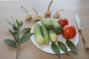 Plate with fresh vegetables on table. Cucumber. Fresh, raw vegetables on the table