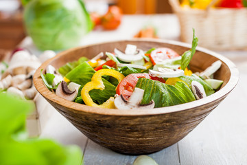 vegetable salad bowl on kitchen table, balanced diet