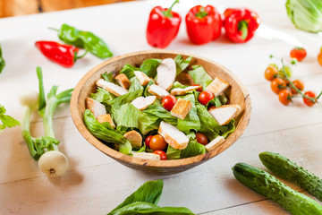 chicken salad bowl on kitchen table, balanced diet