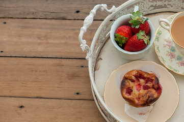 Breakfast with strawberries and muffins