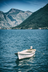 Lonely boat on a water in a Boka Kotor bay