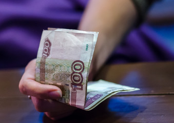 Russian paper money in a man's hand