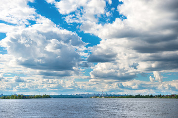 Landscape with river and city on horizon