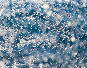 Obraz premium Abstract background of drops of water on the fly