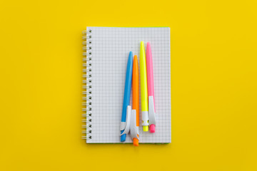 Notebook with colored pens