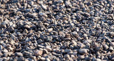 Crushed stone on the road as a background