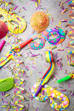 Colorful party accessories on gray background