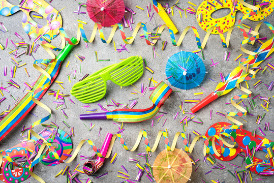 Colorful party accessories on gray background