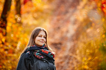 Fototapeta na wymiar Woman in autumn forest