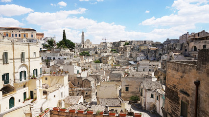 Fototapeta na wymiar Cityscape of the picturesque old town of Matera (Sassi di Matera) with the characteristics ancient tuff houses. Matera is also UNESCO World Heritage Site and European Capital of Culture 2019, Italy 