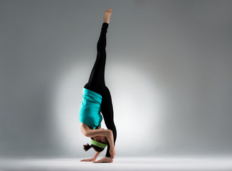 elegant bodybuilding woman single feet standing