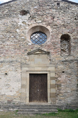 Fototapeta na wymiar Entrance of the church of Santa Maria de Lillet in La Poble de Lillet, Bergueda, Barcelona ,province, Catalonia, Spain