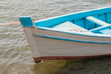 Fototapeta na wymiar Prow of a wooden fishing boat on the deck in harbour, Adriatic sea, Croatia