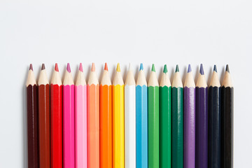 Multicolored pencils for drawing on a white background
