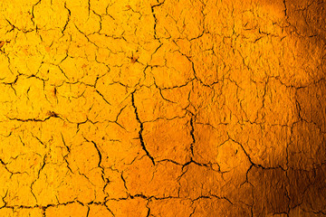 Clay wall in golden light as background