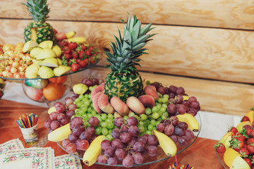 Plate with grape, bananas and pineapple