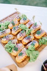 Eclairs with onion and green salad