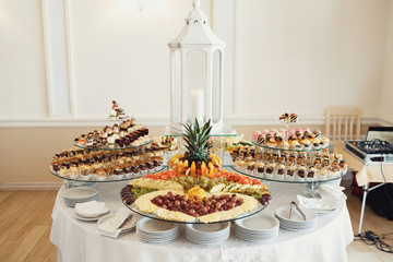 Delicious fancy cakes made of chocolate and cheese stand on the table