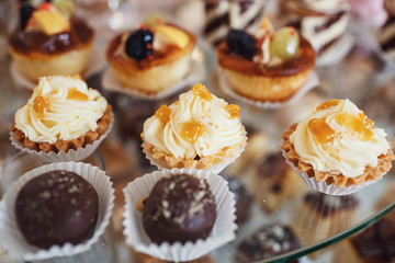 Cupcakes with cream and chocolates