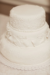 Obraz na płótnie Canvas White wedding cake covered with icing