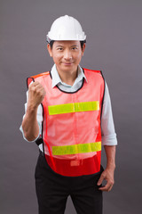 confident, happy, smiling, professional asian engineer man, concept of male civil construction worker, builder, architect, mechanic, electrician posing for successful career