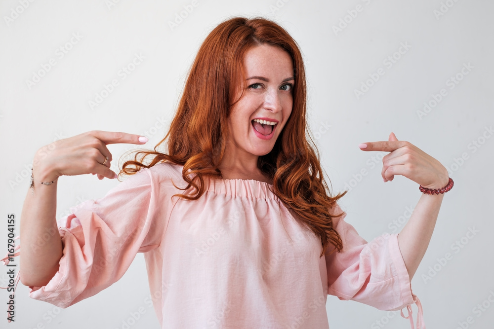 Wall mural portrair of caicasian red haired woman proud of herself.