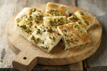 Homemade bread with olives, herbs and olive oil