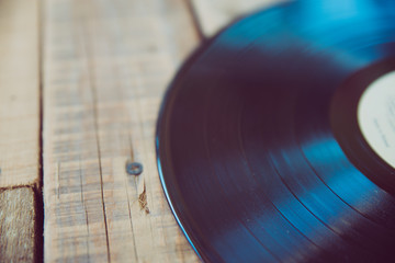 Vinyl on wooden table, small depth of focus, retro filter