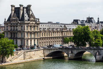 Fototapeta na wymiar Louvre Museum (Musee du Louvre) and Pont Royal bridge. Paris, France