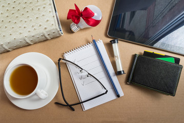 Mix of office supplies and business gadgets on office desk