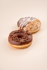 Side view of two donuts isolated over white