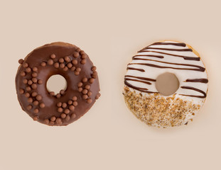Two tasty donuts isolated over white