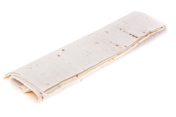 Thin lavash, rolled up, on white background