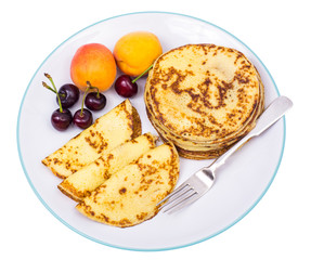 Large plate of fruit and pancakes