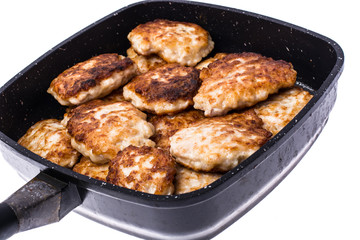 Fried chopped cutlets in frying pan