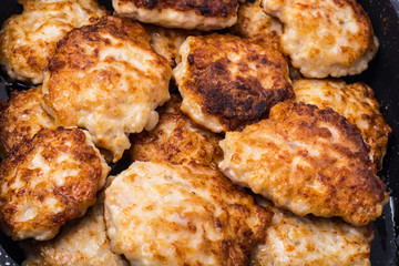 Fried chopped cutlets in frying pan