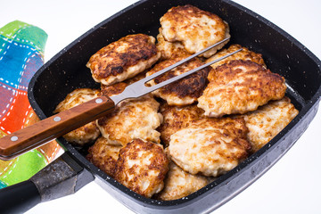 Fried chopped cutlets in frying pan