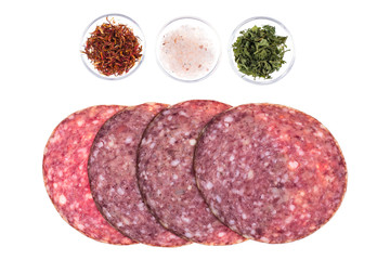 Round slices of chopped sausage on white background