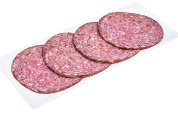 Round slices of chopped sausage on white background