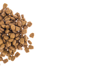 Pile of granulated animal feeds on white background