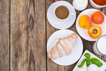 Breakfast table setting with  chocolate flakes, mozzarella,  jui